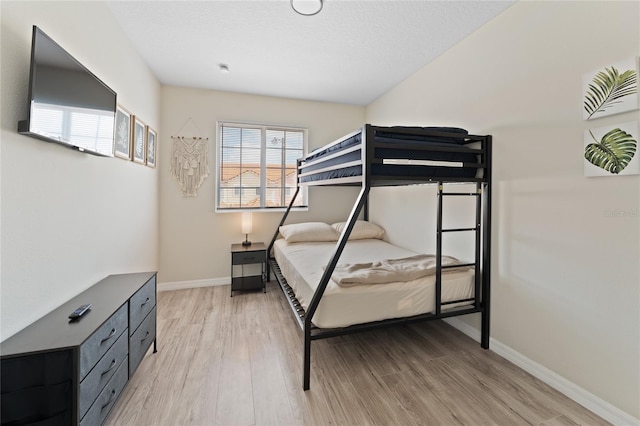 1176 S Beach Cir, Kissimmee, FL 34746 - bedroom featuring light wood-style flooring and baseboards
