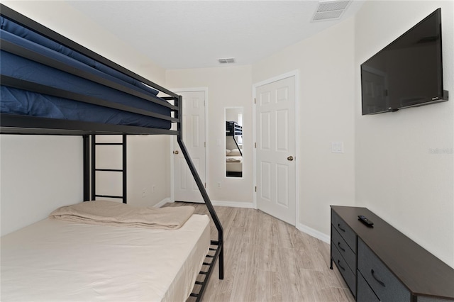 1176 S Beach Cir, Kissimmee, FL 34746 - unfurnished bedroom with light wood-style floors and baseboards