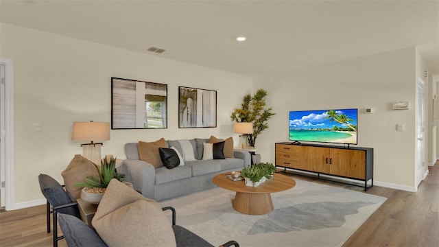 5650 Paddock Fence Ln, Apopka, FL 32712 - living area with wood finished floors and baseboards
