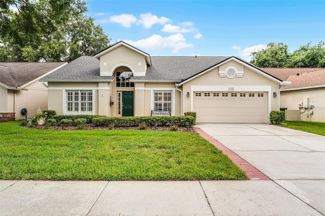 1326 Hampshire Place Cir, Altamonte Springs, FL 32714 - view of front facade featuring stucco siding, concrete driveway, a garage, and a front lawn