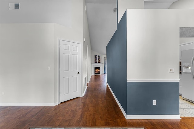 1326 Hampshire Place Cir, Altamonte Springs, FL 32714 - corridor featuring wood finished floors and vaulted ceiling