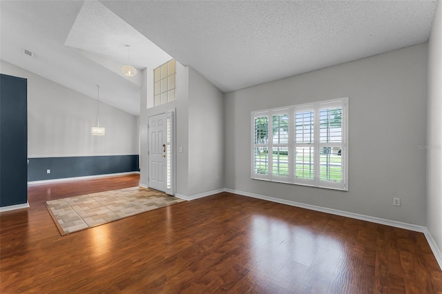 1326 Hampshire Place Cir, Altamonte Springs, FL 32714 - empty room with wood finished floors, lofted ceiling, and a textured ceiling
