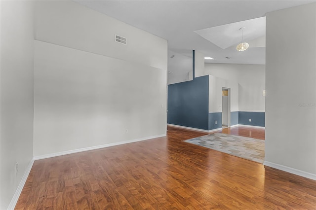 1326 Hampshire Place Cir, Altamonte Springs, FL 32714 - empty room with wood finished floors and high vaulted ceiling