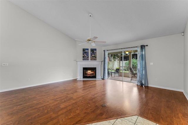 1326 Hampshire Place Cir, Altamonte Springs, FL 32714 - unfurnished living room featuring vaulted ceiling, wood finished floors, ceiling fan, and a fireplace