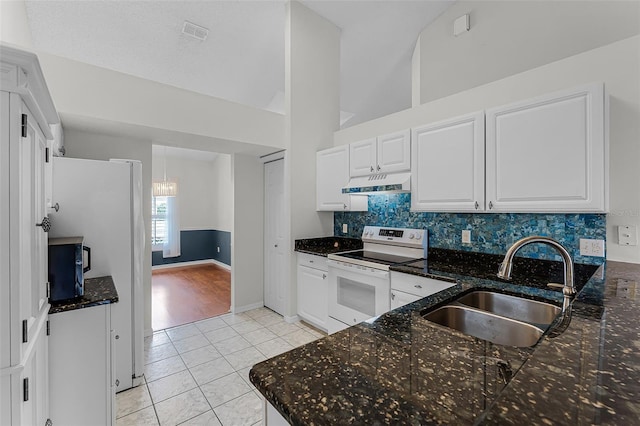 1326 Hampshire Place Cir, Altamonte Springs, FL 32714 - kitchen featuring electric stove, under cabinet range hood, light tile patterned floors, tasteful backsplash, and white cabinets