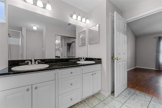 1326 Hampshire Place Cir, Altamonte Springs, FL 32714 - bathroom featuring double vanity, marble finish floors, and a shower