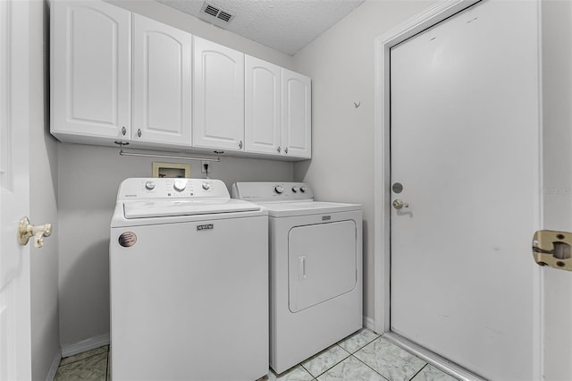 1326 Hampshire Place Cir, Altamonte Springs, FL 32714 - washroom with light marble finish floors, cabinet space, independent washer and dryer, and a textured ceiling
