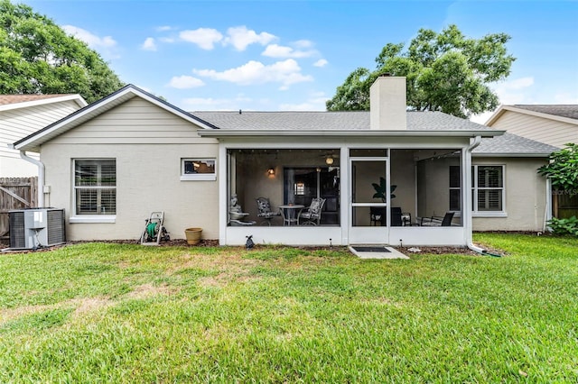 1326 Hampshire Place Cir, Altamonte Springs, FL 32714 - rear view of house with a chimney, a sunroom, and roof with shingles
