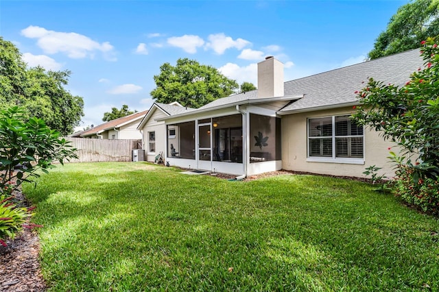 1326 Hampshire Place Cir, Altamonte Springs, FL 32714 - rear view of property with a chimney, a sunroom, a shingled roof, and stucco siding