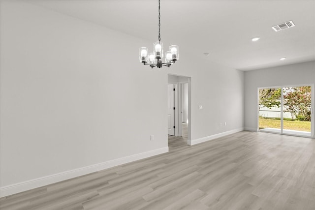 1970 SW 160th Pl, Ocala, FL 34473 - empty room featuring a chandelier, light wood-style flooring, and recessed lighting