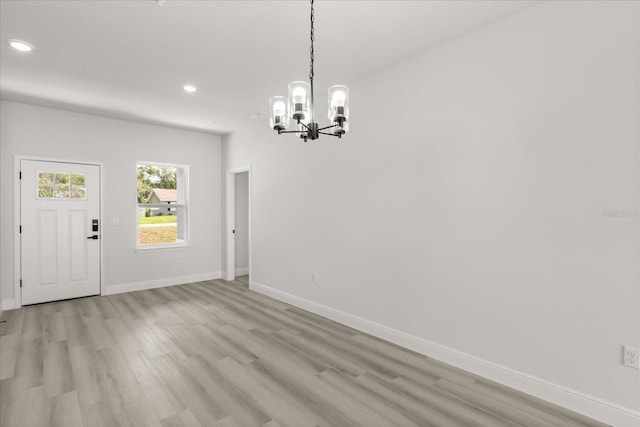 1970 SW 160th Pl, Ocala, FL 34473 - unfurnished dining area with a chandelier, light wood finished floors, and recessed lighting