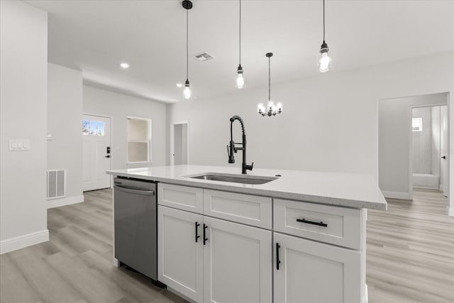 1970 SW 160th Pl, Ocala, FL 34473 - kitchen featuring stainless steel dishwasher, light wood-type flooring, white cabinetry, hanging light fixtures, and recessed lighting