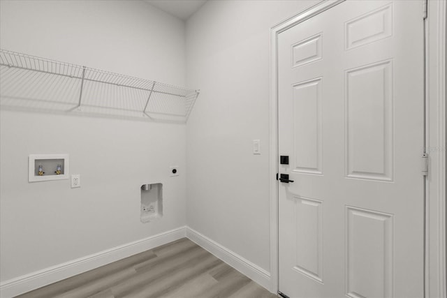 1970 SW 160th Pl, Ocala, FL 34473 - laundry room with hookup for an electric dryer, light wood-style floors, and washer hookup