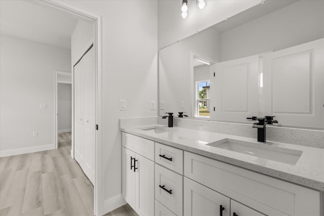 1970 SW 160th Pl, Ocala, FL 34473 - bathroom with double vanity and wood finished floors