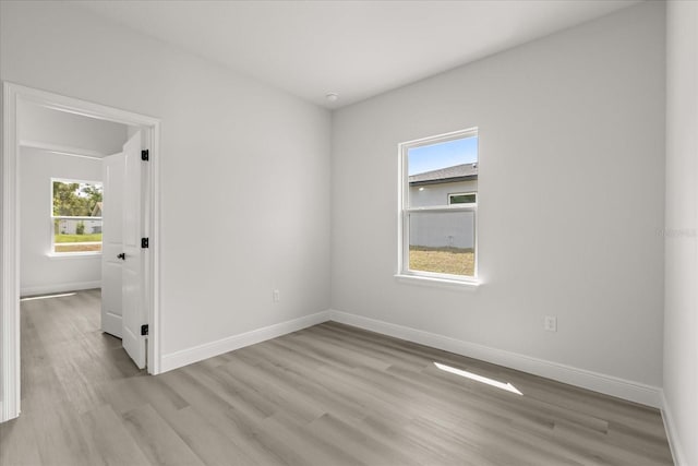 1970 SW 160th Pl, Ocala, FL 34473 - empty room with plenty of natural light and light wood-style floors