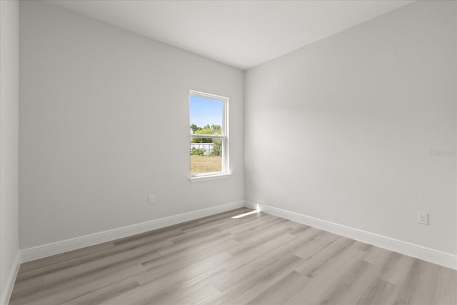 1970 SW 160th Pl, Ocala, FL 34473 - spare room featuring light wood-style floors and baseboards