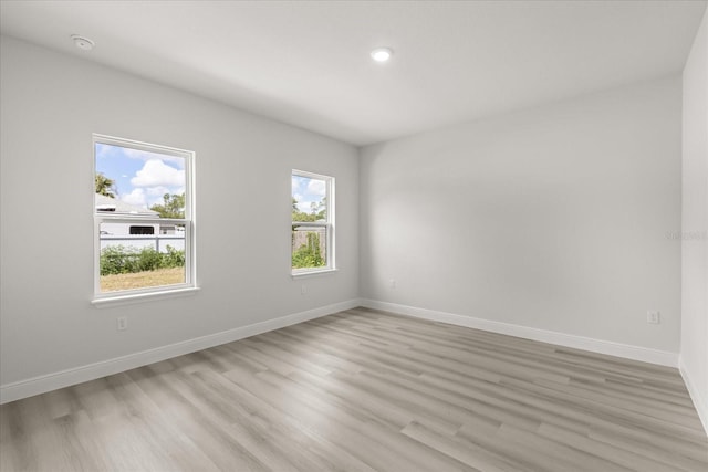 1970 SW 160th Pl, Ocala, FL 34473 - empty room with light wood-style floors, a smoke detector, and recessed lighting