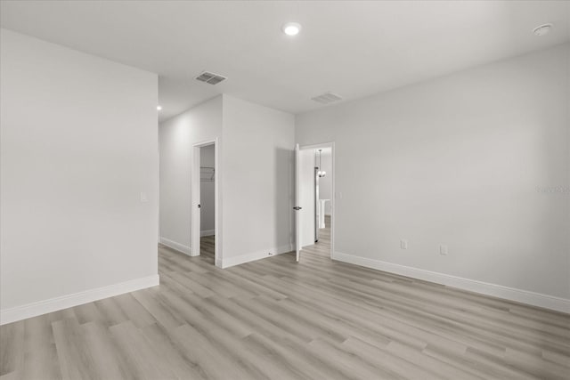 1970 SW 160th Pl, Ocala, FL 34473 - empty room with light wood-style flooring and recessed lighting