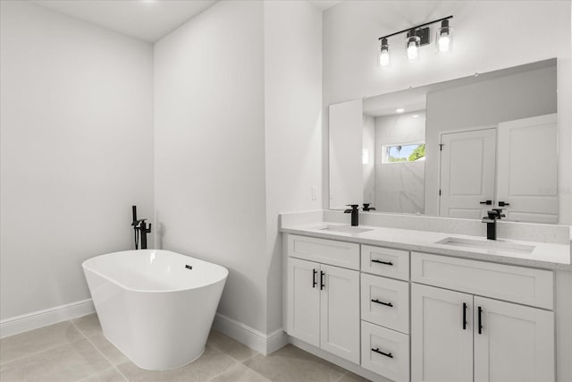 1970 SW 160th Pl, Ocala, FL 34473 - bathroom with double vanity, a freestanding tub, and tile patterned floors
