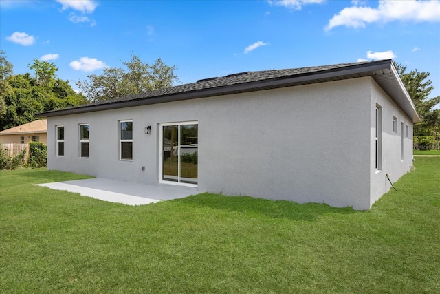 1970 SW 160th Pl, Ocala, FL 34473 - rear view of house with a patio area, stucco siding, and a lawn