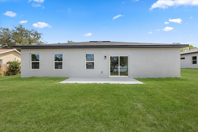 1970 SW 160th Pl, Ocala, FL 34473 - back of house featuring a patio area, stucco siding, and a yard