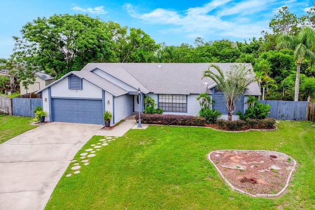 9001 New Orleans Ct, Orlando, FL 32818 - view of front of home featuring a garage, concrete driveway, and roof with shingles
