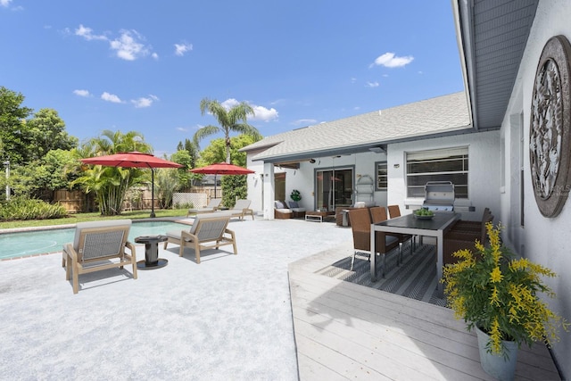 9001 New Orleans Ct, Orlando, FL 32818 - wooden terrace with a grill and outdoor dining space