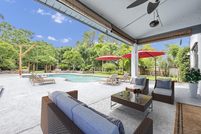 9001 New Orleans Ct, Orlando, FL 32818 - view of patio with an outdoor hangout area, ceiling fan, and view of wooded area