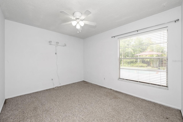 9001 New Orleans Ct, Orlando, FL 32818 - carpeted empty room featuring a ceiling fan and a textured ceiling