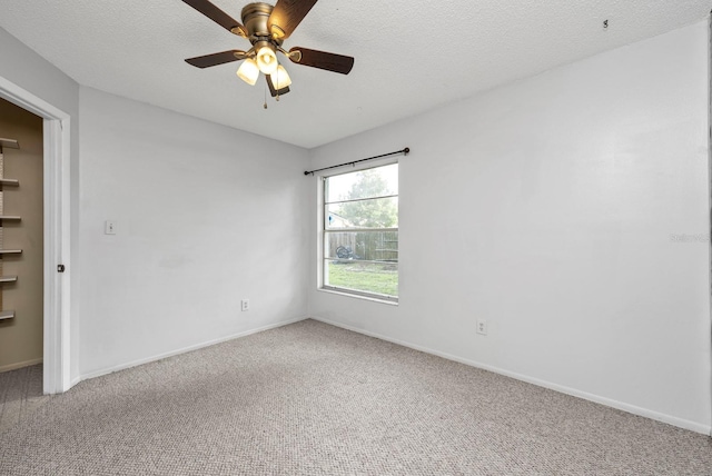 9001 New Orleans Ct, Orlando, FL 32818 - spare room featuring carpet, a ceiling fan, and a textured ceiling