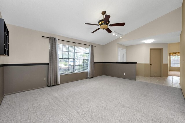 9001 New Orleans Ct, Orlando, FL 32818 - unfurnished room with lofted ceiling, carpet, a ceiling fan, plenty of natural light, and rail lighting