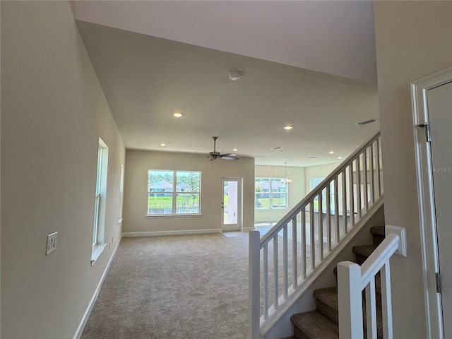 4113 Sagefield Dr, Harmony, FL 34773 - staircase with carpet flooring, recessed lighting, a ceiling fan, and a chandelier