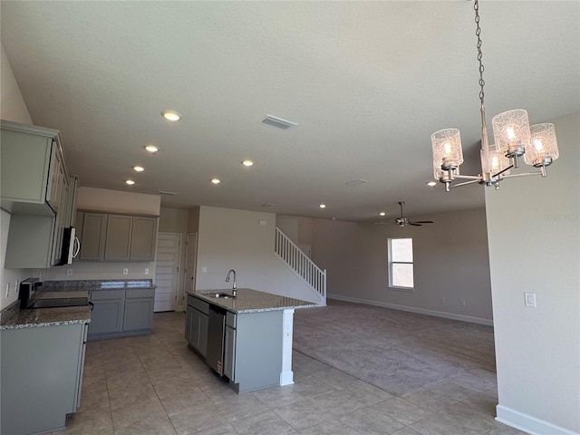 4113 Sagefield Dr, Harmony, FL 34773 - kitchen featuring appliances with stainless steel finishes, a chandelier, gray cabinets, a ceiling fan, and recessed lighting