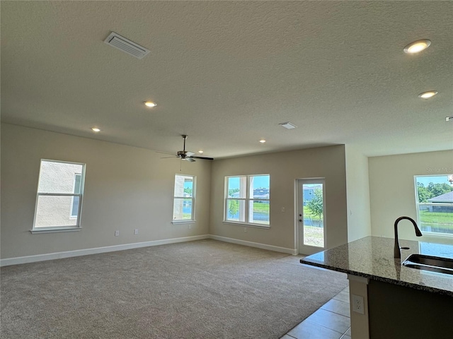 4113 Sagefield Dr, Harmony, FL 34773 - unfurnished dining area with healthy amount of natural light, recessed lighting, a textured ceiling, a ceiling fan, and light carpet