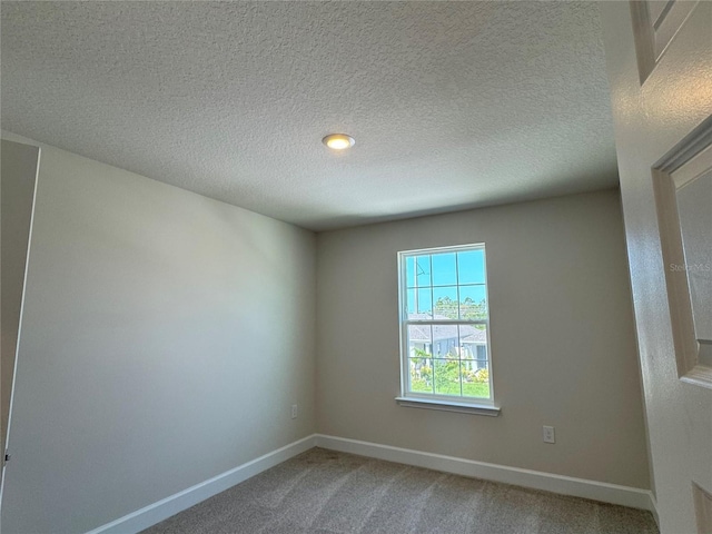 4113 Sagefield Dr, Harmony, FL 34773 - spare room featuring light carpet and a textured ceiling