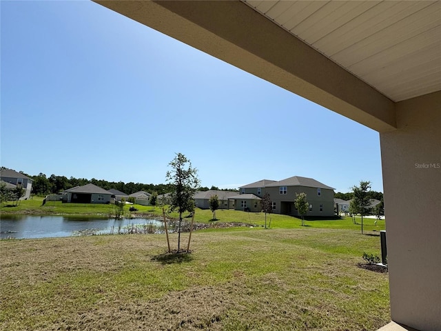 4113 Sagefield Dr, Harmony, FL 34773 - view of green lawn featuring a water view and a residential view