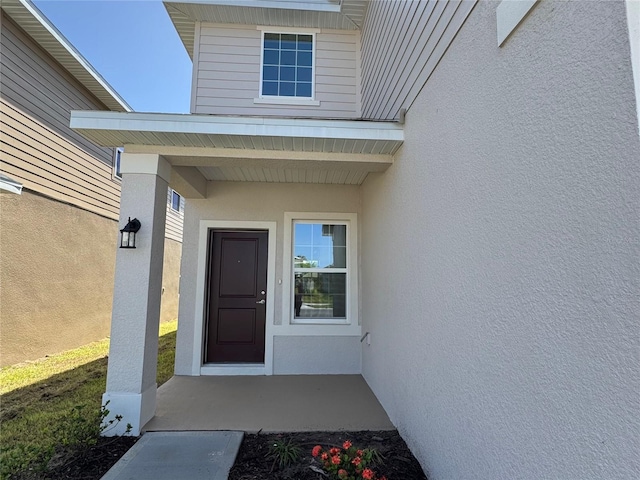 4113 Sagefield Dr, Harmony, FL 34773 - property entrance with stucco siding