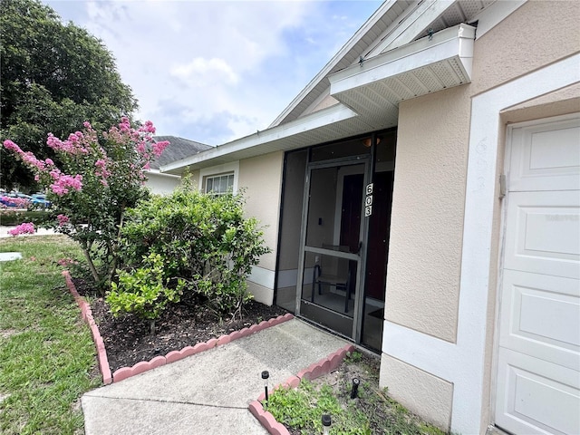603 Reston Pl, Davenport, FL 33897 - entrance to property featuring stucco siding