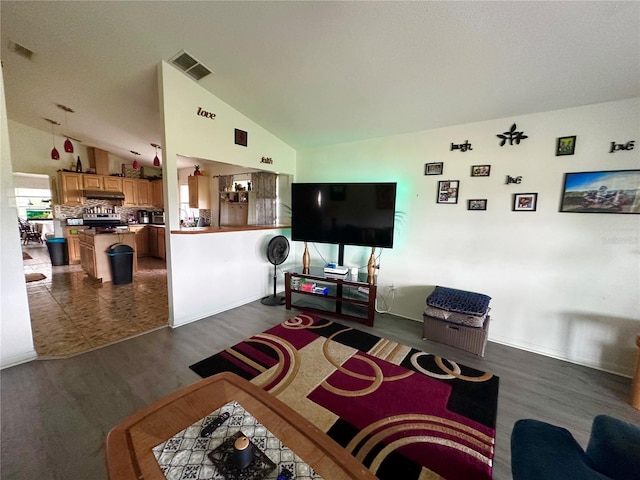 603 Reston Pl, Davenport, FL 33897 - living room featuring dark wood finished floors and lofted ceiling