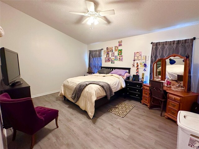 603 Reston Pl, Davenport, FL 33897 - bedroom featuring light wood-type flooring, ceiling fan, a textured ceiling, and vaulted ceiling