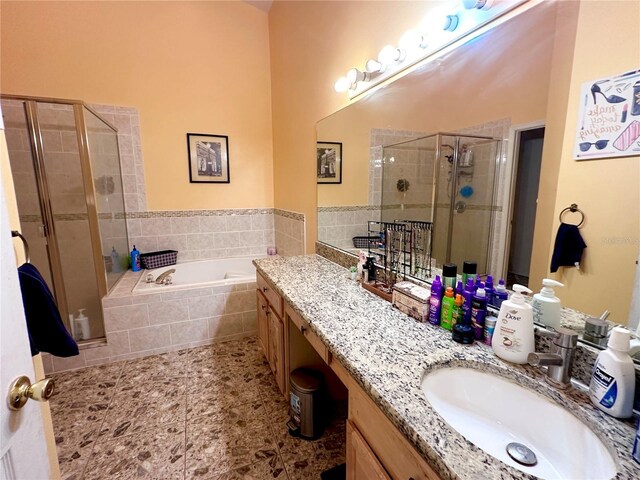 603 Reston Pl, Davenport, FL 33897 - bathroom featuring a shower stall, a bath, and vanity