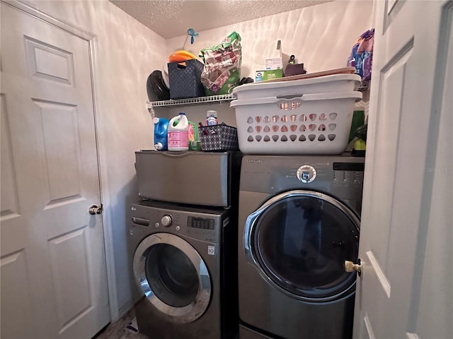 603 Reston Pl, Davenport, FL 33897 - laundry room with washing machine and dryer and a textured ceiling