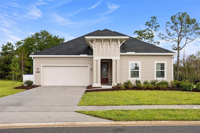2149 Raglan Cir, Ormond Beach, FL 32174 - view of front of property featuring an attached garage, a front lawn, driveway, and roof with shingles
