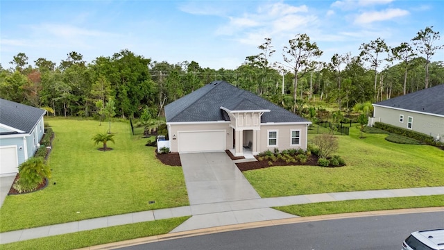 2149 Raglan Cir, Ormond Beach, FL 32174 - view of front of property with a garage, driveway, a front lawn, and roof with shingles