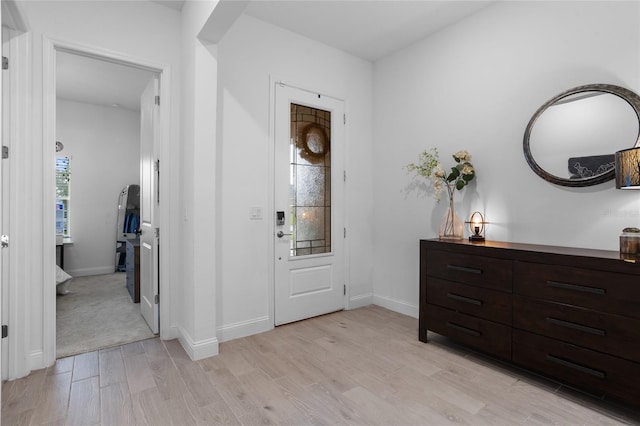 2149 Raglan Cir, Ormond Beach, FL 32174 - foyer with light wood-style floors and baseboards