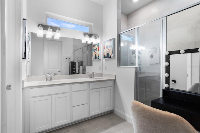 2149 Raglan Cir, Ormond Beach, FL 32174 - full bathroom featuring double vanity, a stall shower, and wood finished floors