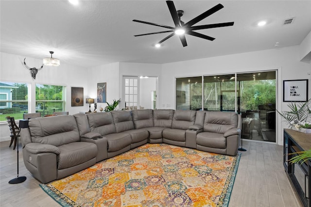 2149 Raglan Cir, Ormond Beach, FL 32174 - living room with a ceiling fan, light wood-style floors, and plenty of natural light