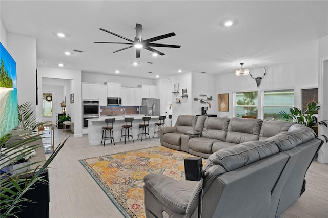 2149 Raglan Cir, Ormond Beach, FL 32174 - living area with a ceiling fan, recessed lighting, and light wood-style flooring