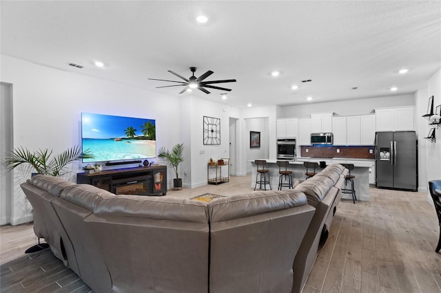 2149 Raglan Cir, Ormond Beach, FL 32174 - living area with light wood-style flooring, ceiling fan, and recessed lighting