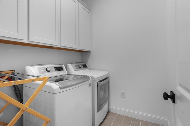 2149 Raglan Cir, Ormond Beach, FL 32174 - laundry room with independent washer and dryer, cabinet space, and wood tiled floors